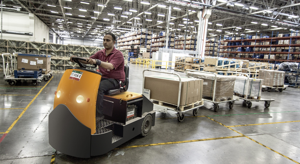 Man driving truck in warehouse