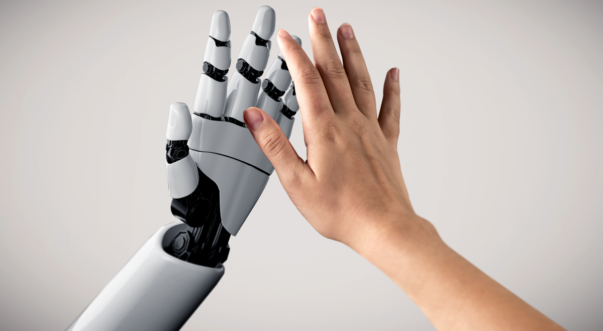 Robot and human hands doing a high five
